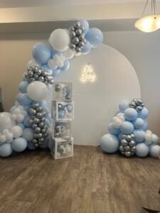 Blue and silver baby shower balloon backdrop with “Oh Baby” sign and stacked baby blocks by Iconic Events Edmonton. Making Every Event in Edmonton Iconic.